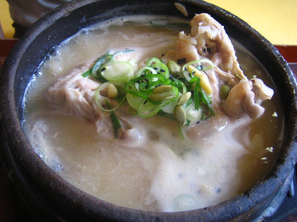Samgyetang, a whole chicken stuffed with rice and ginseng in a milky broth