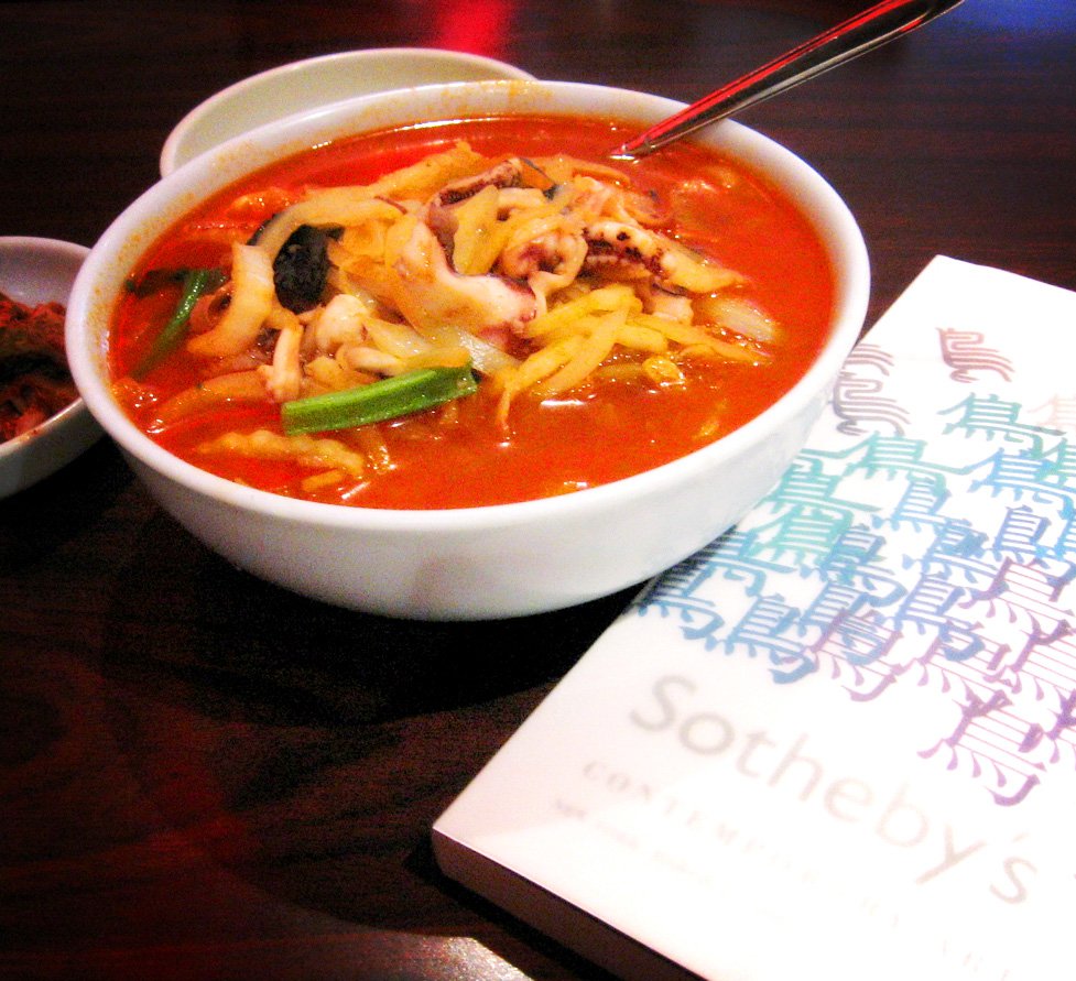 A bowl of jjamppong, Korean-Chinese spicy red seafood noodle soup